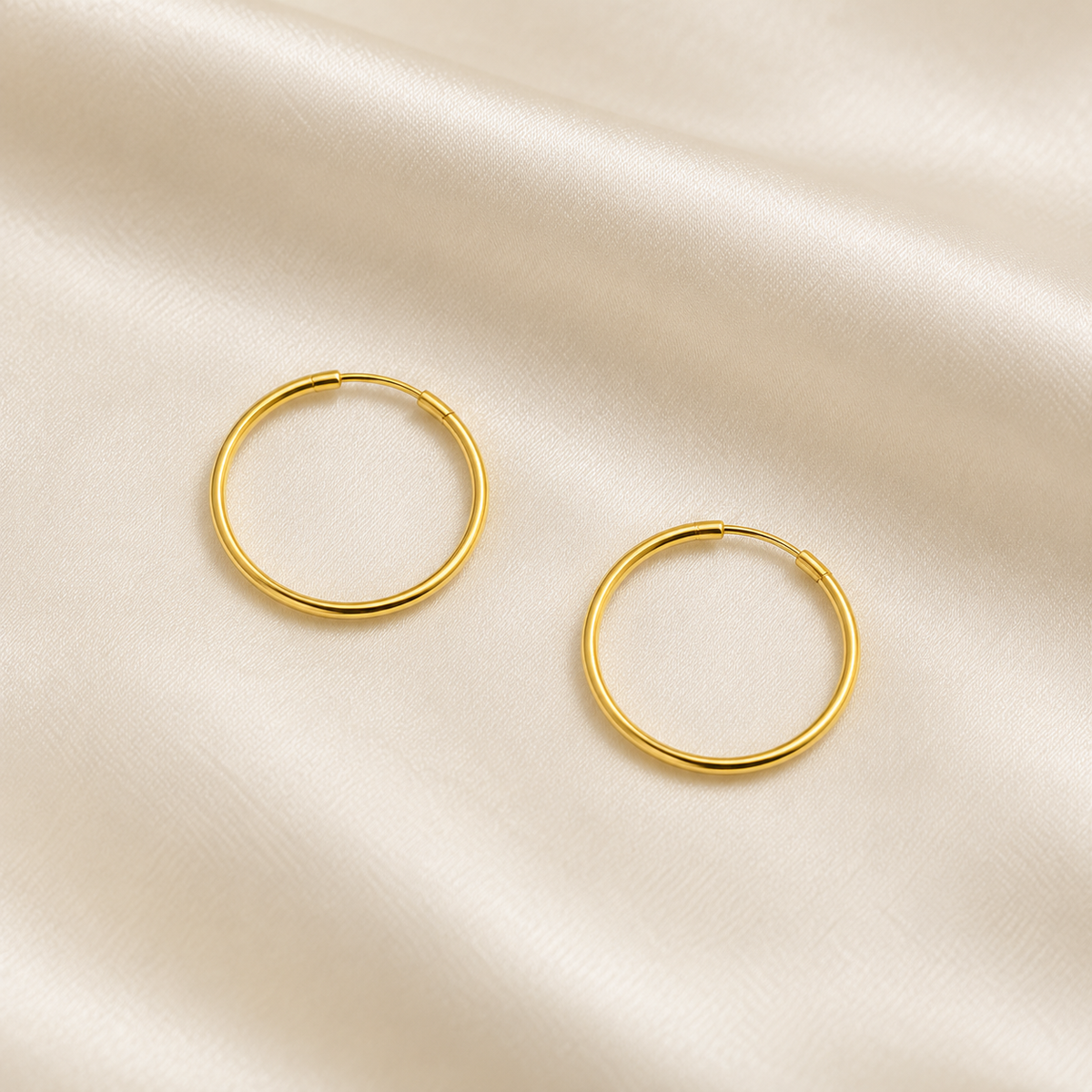 15mm gold-plated hoop pair, overhead digital visualisation on ivory silk