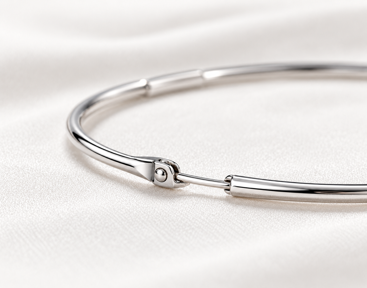 Fine sterling silver hoop fastening, macro digital visualisation on ivory silk