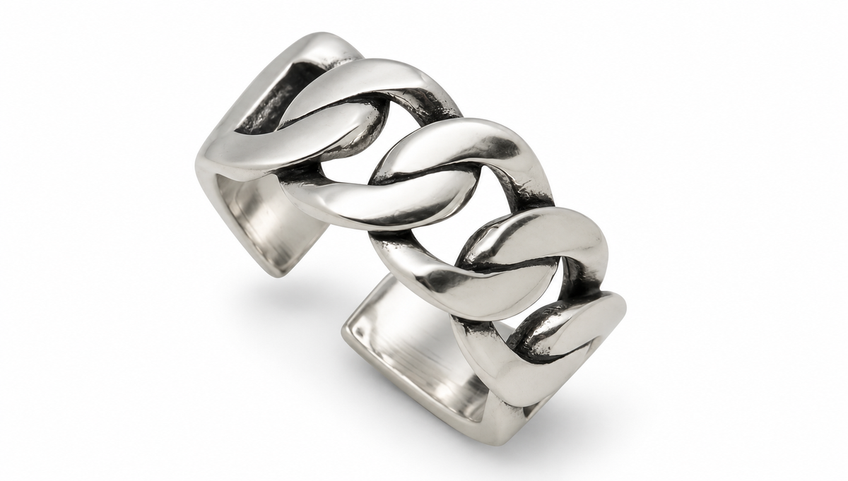 Sterling silver chain-link statement ring on white studio background