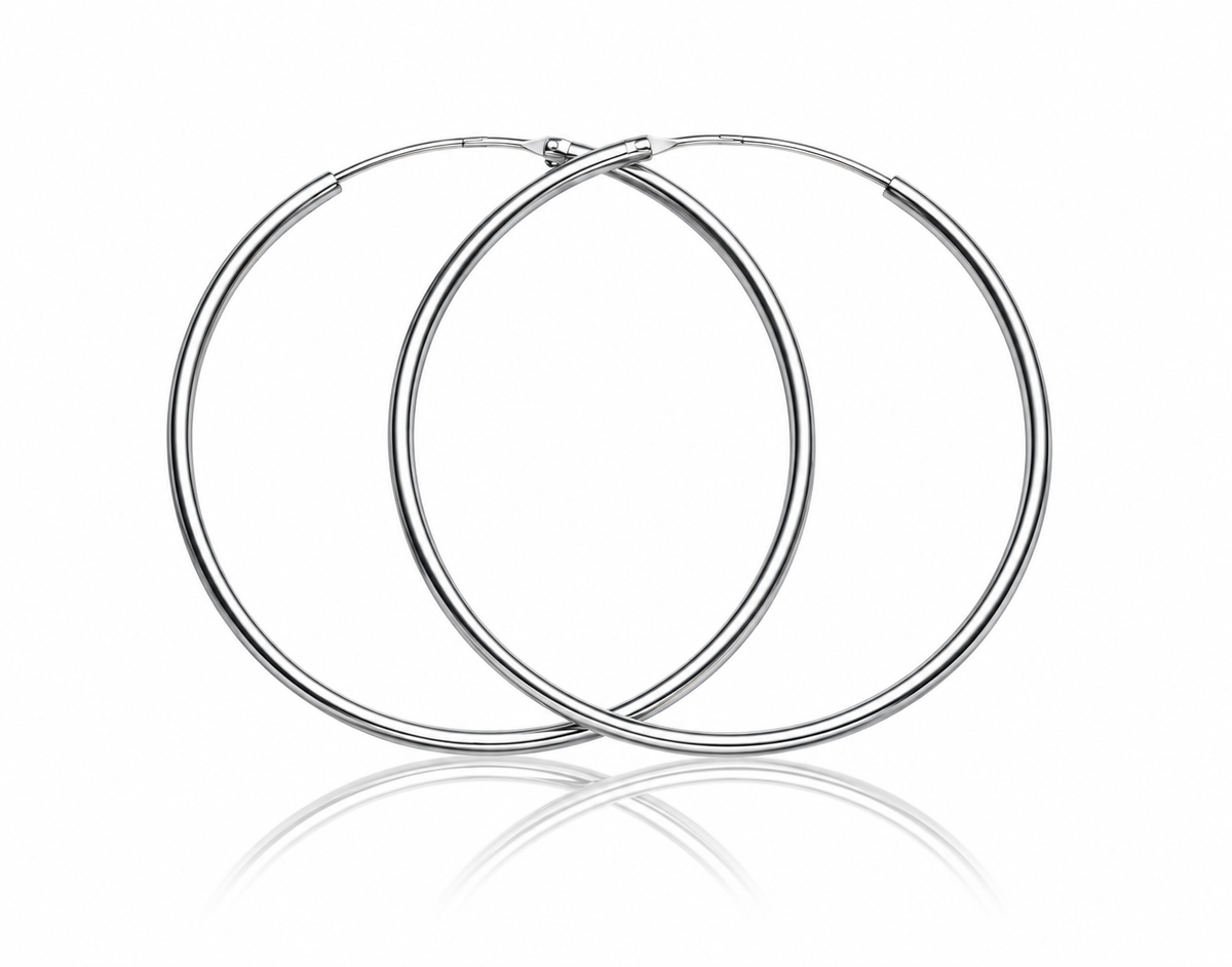 Fine silver hoop earrings on white studio background