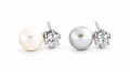 Pearl and clear CZ silver stud earrings on white studio background