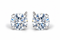 Clear round CZ stud earrings on white studio background