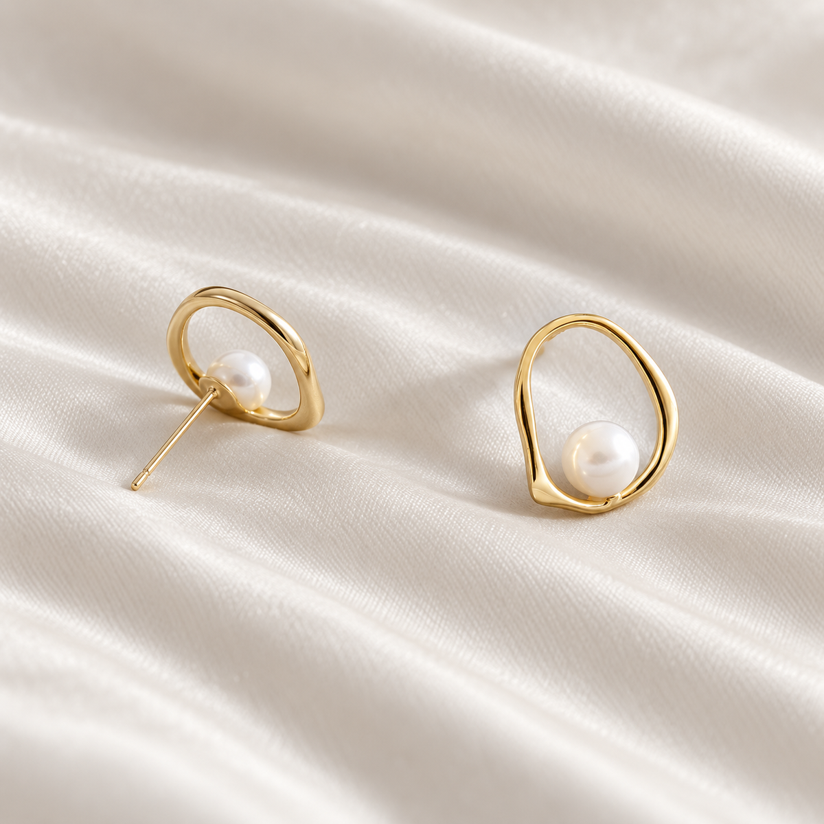 Digital studio visualisation of Yellow Gold shell pearl studs on ivory silk, rear angle